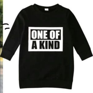 Black toddler dress words in white “One of a kind”